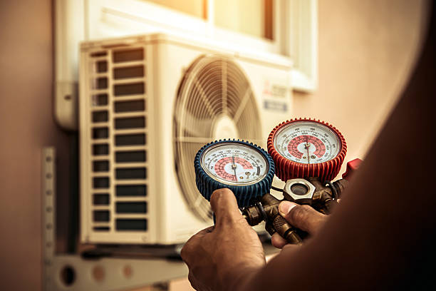 Professional Air Conditioning Service technician working in Mora, MN